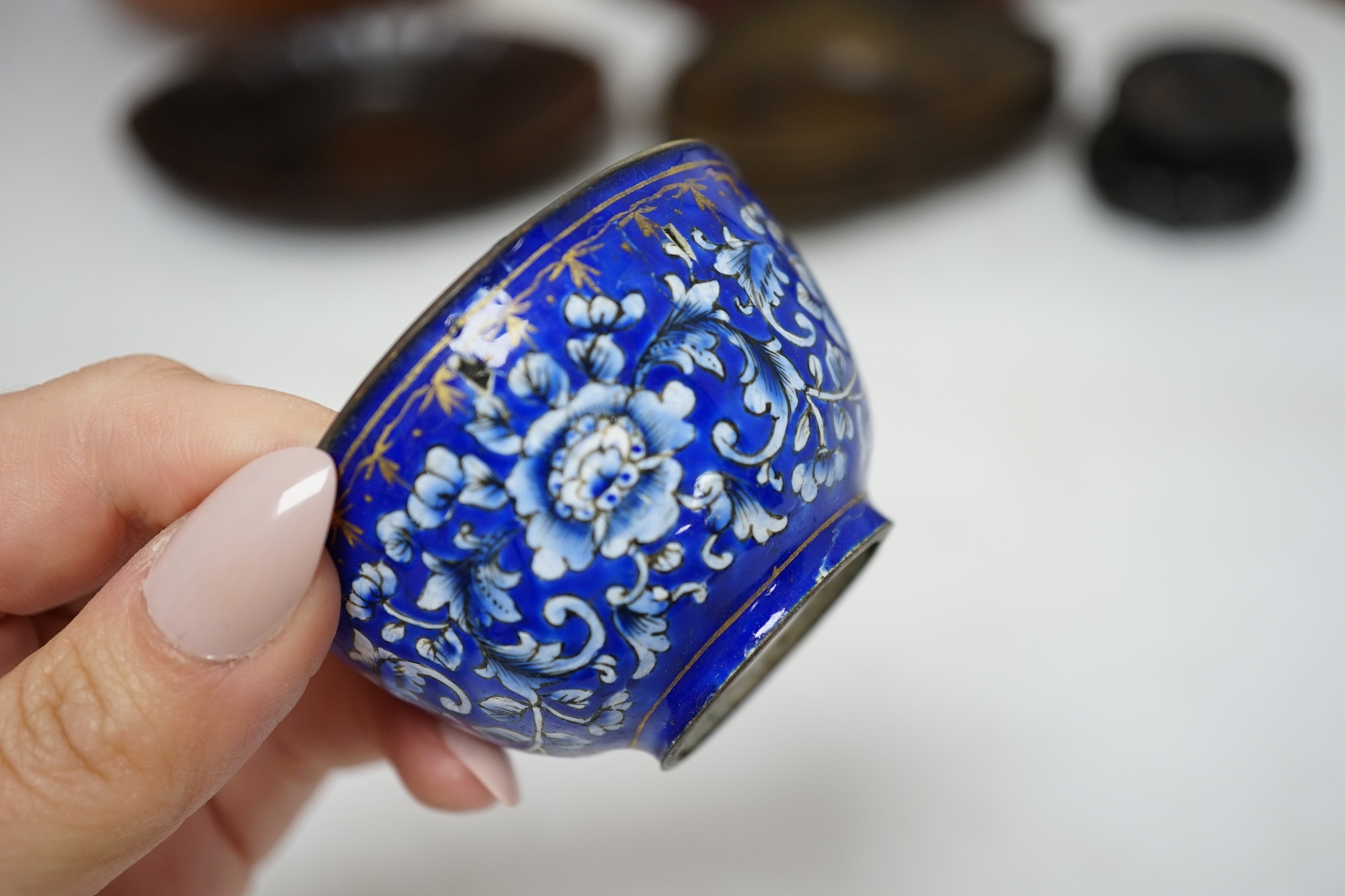 A quantity of Chinese items including a Canton enamel cup, set of four crackle glazed bowls and a gilt tray decorated with flowers and quails, largest 30cm diameter. Condition - fair